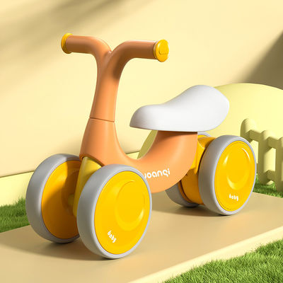 Voiture d'équilibre en plastique orange avec patin à roulettes silencieux et design vert