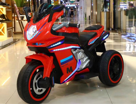 Les enfants de 2 à 8 ans montent sur une moto avec de la musique et de la lumière / batterie rechargeable 12V