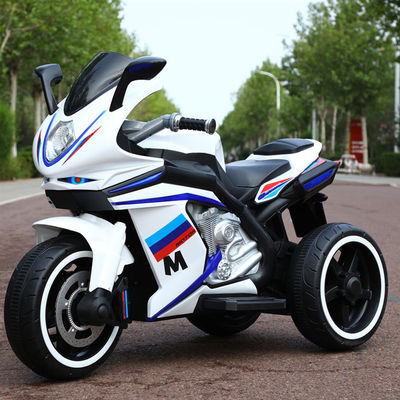 Les enfants de 2 à 8 ans montent sur une moto avec de la musique et de la lumière / batterie rechargeable 12V